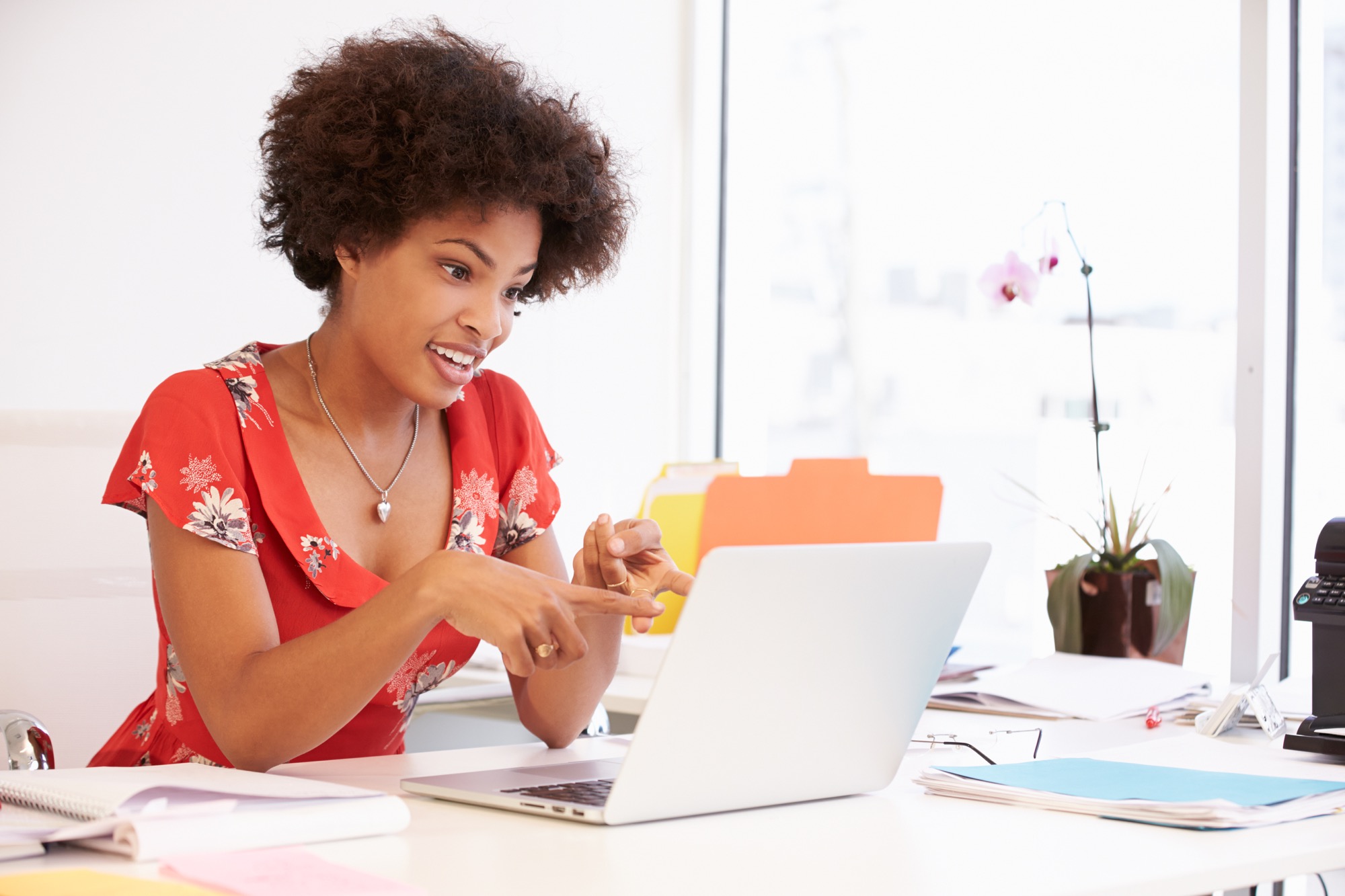 Woman Working At Desk In Design Studio