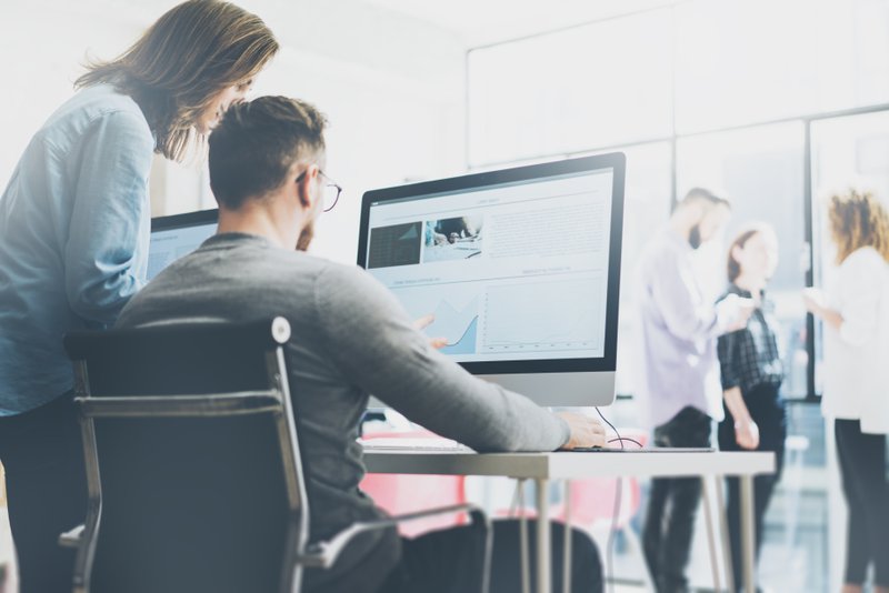 customers researching a business on a computer