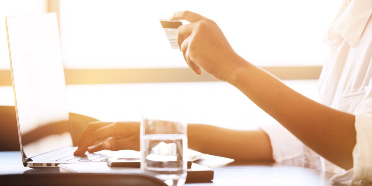 A woman purchasing with a credit card