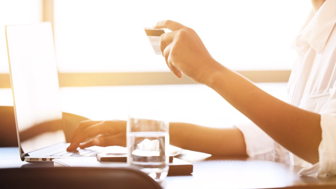 A woman purchasing with a credit card