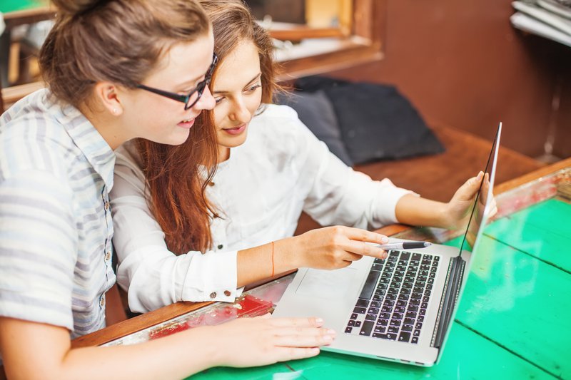 two women reviewing their Composable commerce website
